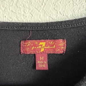 Black 7 for all mankind girls medium shirt. Asymmetric peplum top